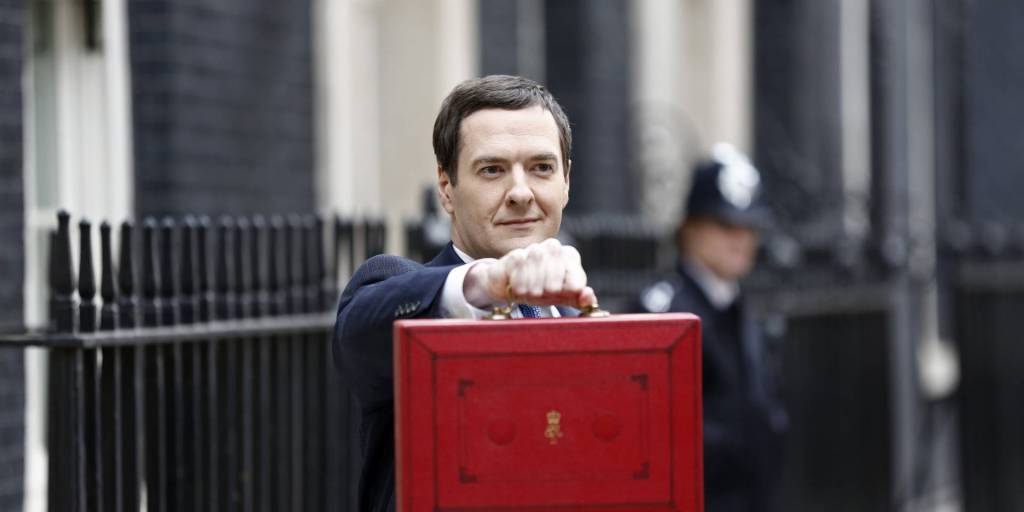 George Osborne, U.K. chancellor of the exchequer, holds the dispatch box containing the 2015 budget as he stands outside 11 Downing Street in London, U.K., on Wednesday, June 8 2014. Photographer: Simon Dawson/Bloomberg via Getty Images