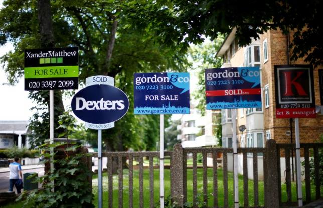 Estate agents boards outside houses in south London